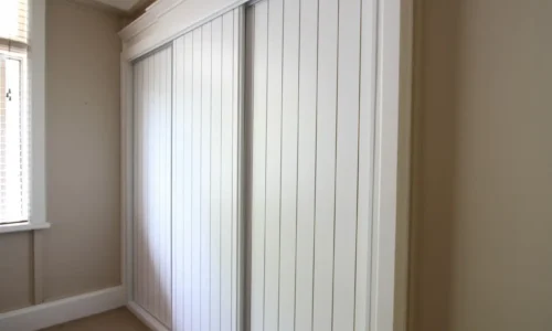 Crafting Elegance: Fully Framed Sliding Wardrobe Doors in Unpainted VJ Routed MDF